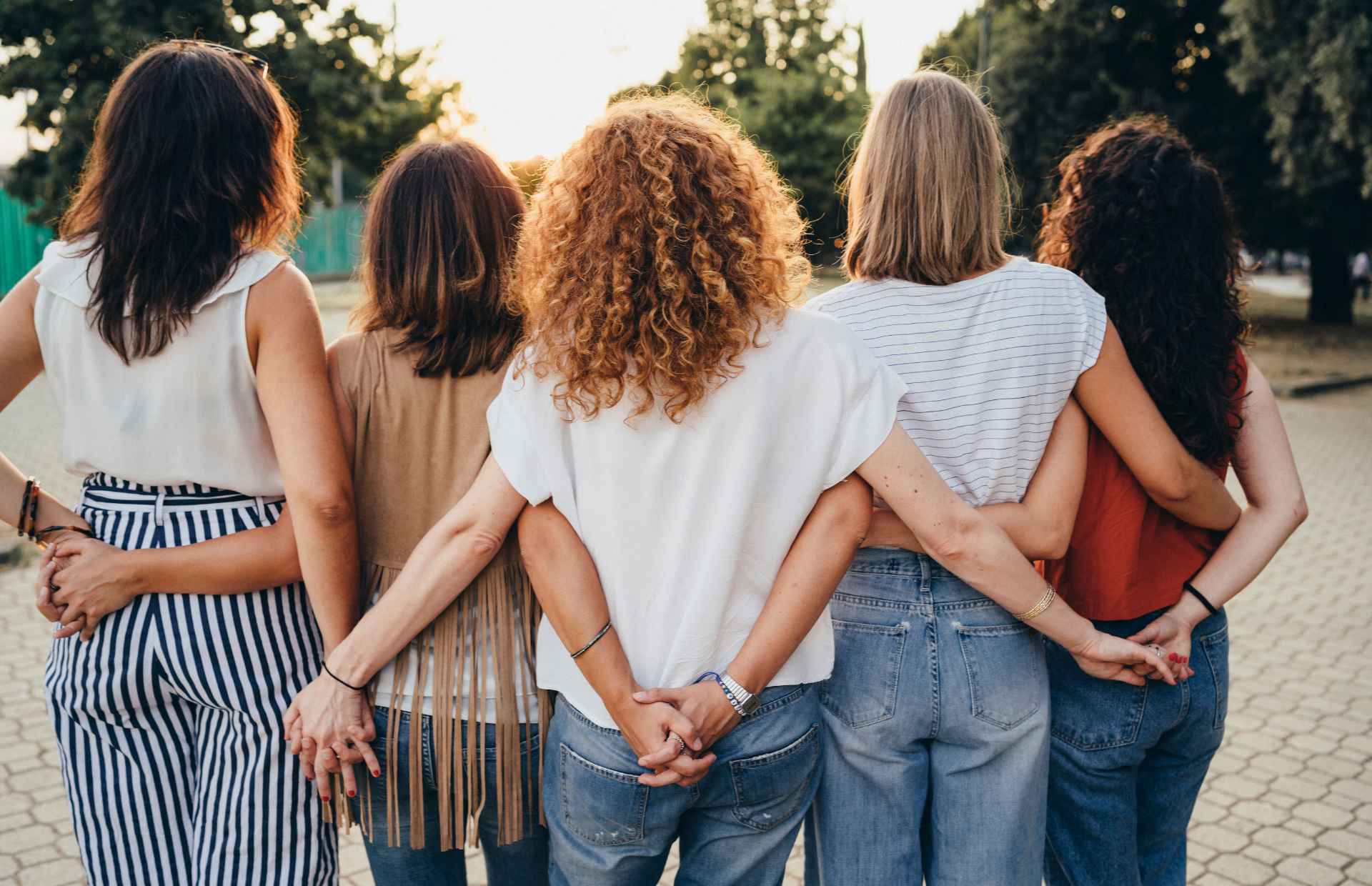 a group of women standing together in support